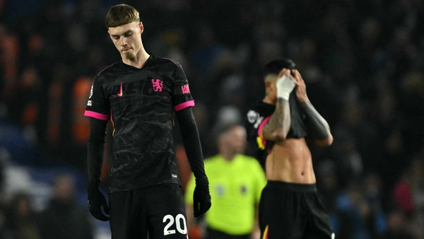Cole Palmer (L) and Enzo Fernandez reacting to Chelsea conceding a second goal to Brighton
