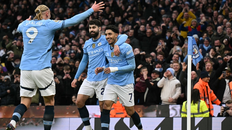 Omar Marmoush (R) is congratulated by teammates after his hat-trick goal