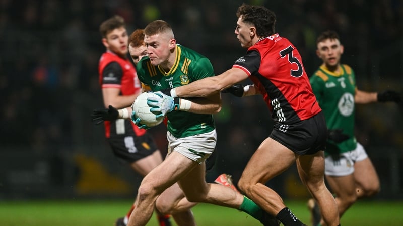 Meath's Jack Flynn gets away from Down defender Pierce Laverty
