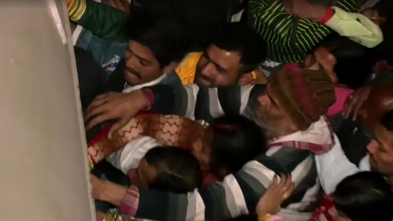 The rush at the station in New Delhi appeared to break out as crowds struggled to board trains for the Kumbh Mela festival