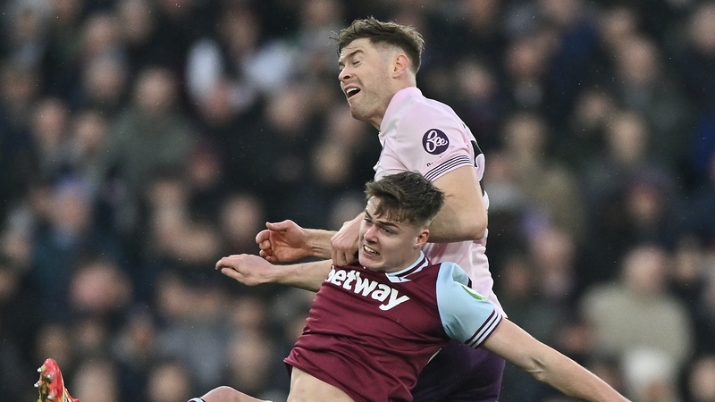 Evan Ferguson (below) battling for possession with Ireland team mate Nathan Collins yesterday