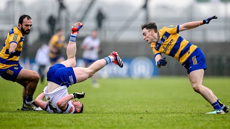 Dylan Byrne of Monaghan in action against Conor Hand, right and Donie Smith of Roscommon