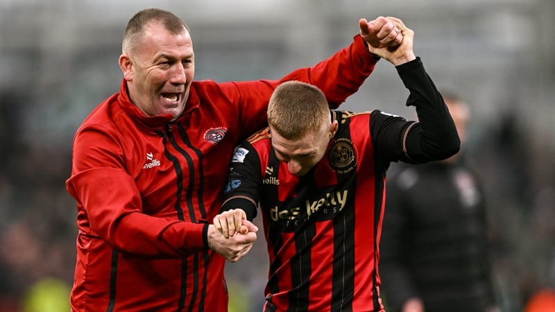 Alan Reynolds celebrates with goal scorer Ross Tierney after the game