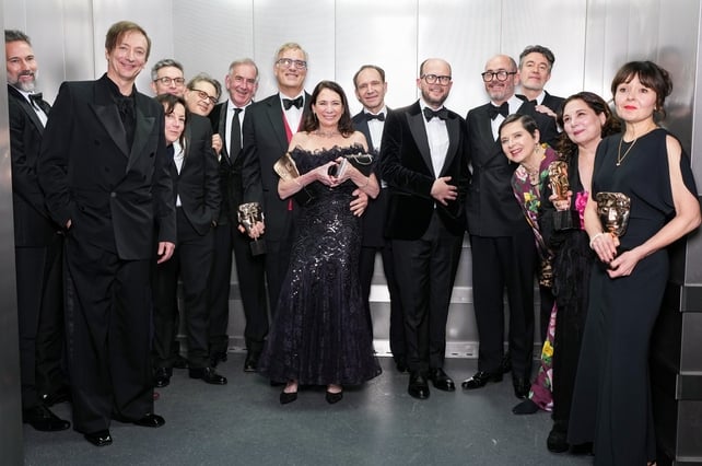 <p>Guest, Volker Bertelmann, Martin Ware, Nina Gold, Danny Cohen, Robert Harris, Michael A Jackman, guest, Ralph Fiennes, Nick Emerson, Edward Berger, Isabella Rossellini, Peter Straughan, Tessa Ross and Juliette Howell</p>
