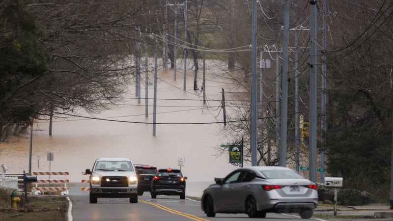 Cars are unable to pass on a flooded road in Clarksville, Tennessee