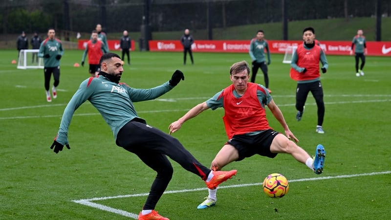 James Norris, pictured with Mo Salah in Liverpool training last December, has moved to Tolka Park on loan