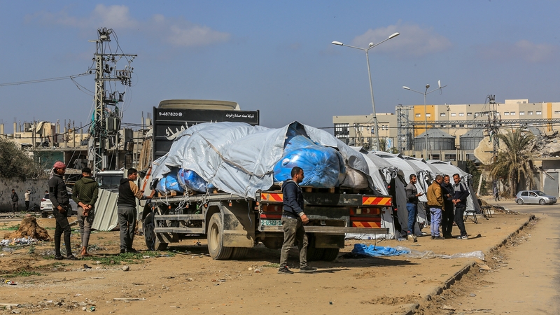 Aid trucks enter Gaza through the Kerem Shalom border crossing in Rafah, Gaza