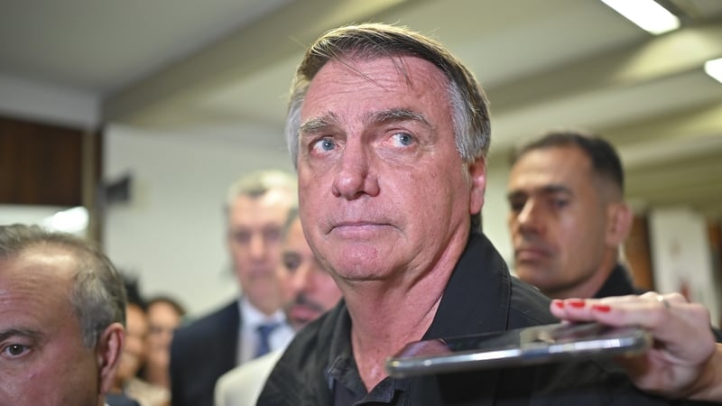 Former Brazilian President Jair Bolsonaro speaks to the press after a visit with Liberal Party leaders in the Federal Senate