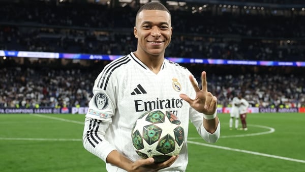 Hat-trick hero Kylian Mbappe celebrates with the match ball