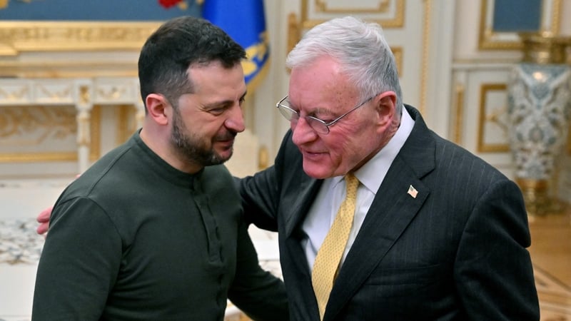 Ukraine's President Volodymyr Zelensky (L) greets US envoy Keith Kellogg at his offices in Kyiv ahead of their meeting