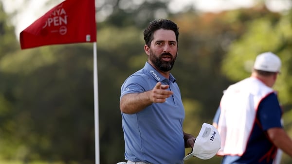 John Parry acknowledges the crowd on the 18th green