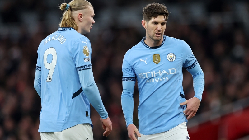 Erling Haaland (L) missed the Manchester City defeat in Madrid where John Stones suffered a muscle injury