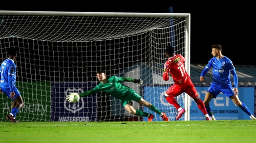 Mipo Odubeko beats Stephen McMullan in the Waterford goal