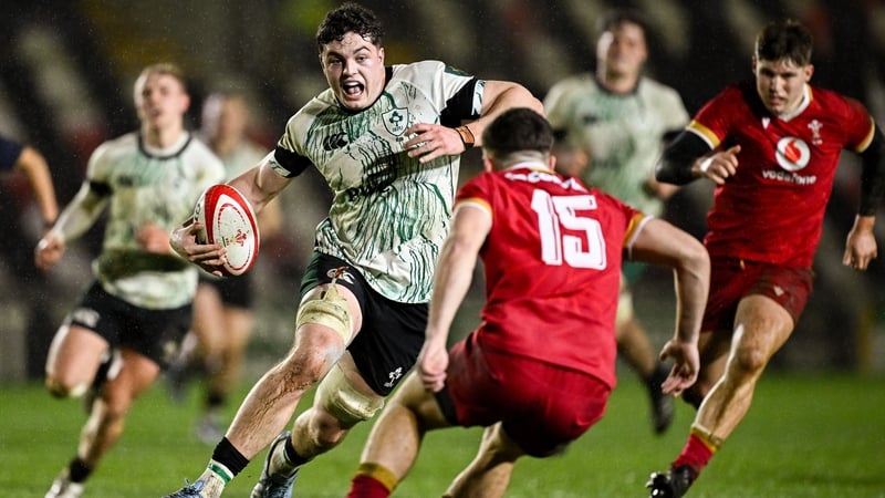 Michael Foy of Ireland in action against Evan Wood at Rodney Parade
