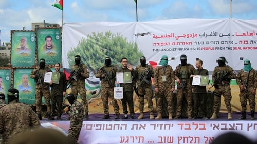 Hamas militants parade Eliya Cohen, Omer Shem Tov and Omer Wenkert in Nuseirat