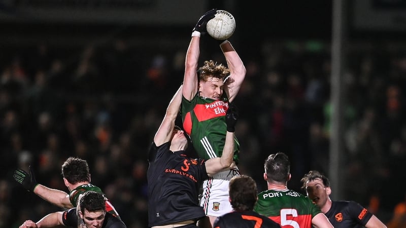 Mayo's Jack Carney battles for a high ball against Niall Grimley of Armagh