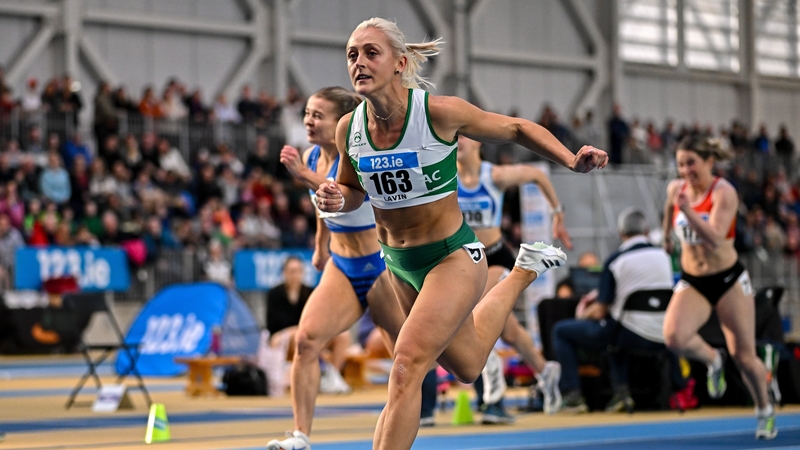 Sarah Lavin (Emerald AC) crossing the finish line to win the women's 60m hurdles final
