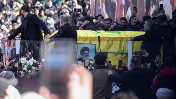 The coffin of Hassan Nasrallah is brought out during the funeral ceremony at the Camille Chamoun Sports City Stadium