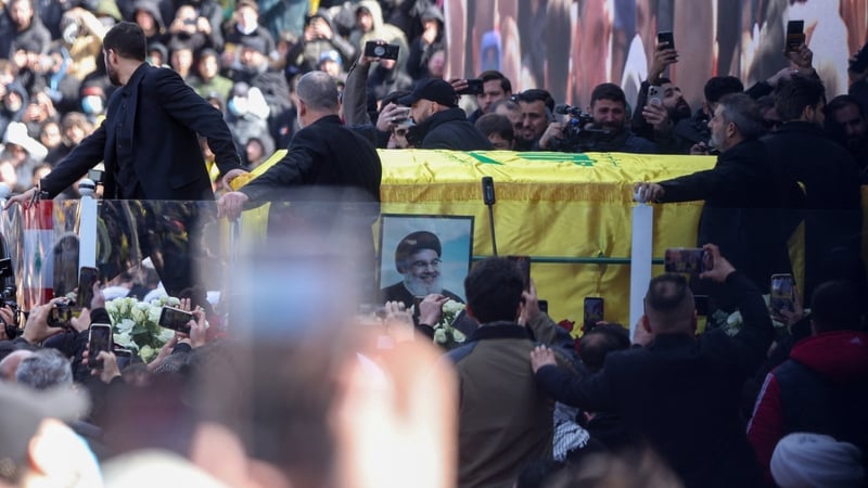 The coffin of Hassan Nasrallah is brought out during the funeral ceremony at the Camille Chamoun Sports City Stadium