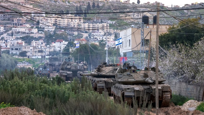 Israeli tanks and bulldozers take positions in the Jenin camp for Palestinian refugees, in the occupied West Bank