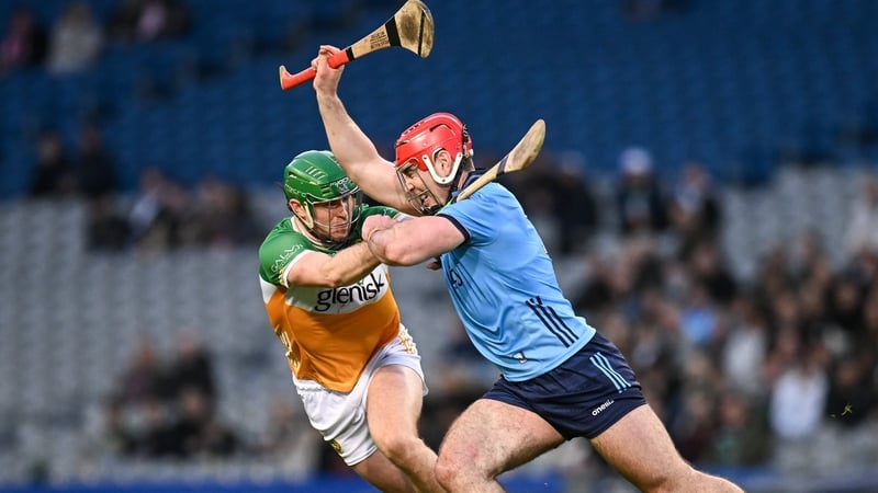 Paddy Smyth of Dublin battles for possession against Brian Duignan of Offaly