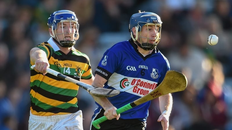 The late Ray Ryan (R), in action for Sarsfields against Glen Rovers' Patrick Horgan in the 2014 Cork club hurling final