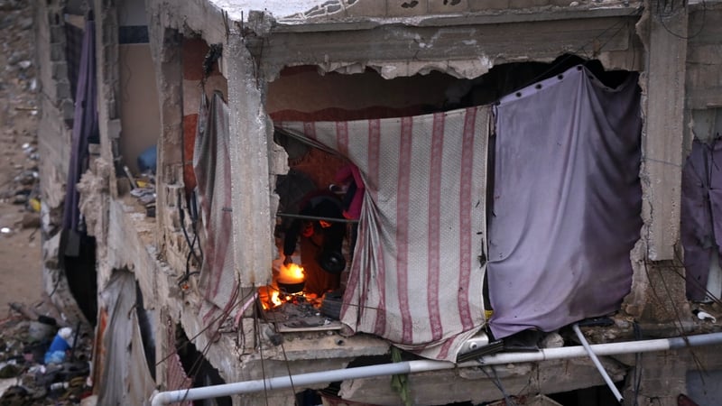 People struggle with the harsh winter conditions in tents set up in demolished houses in Bani Suheila, Khan Younis