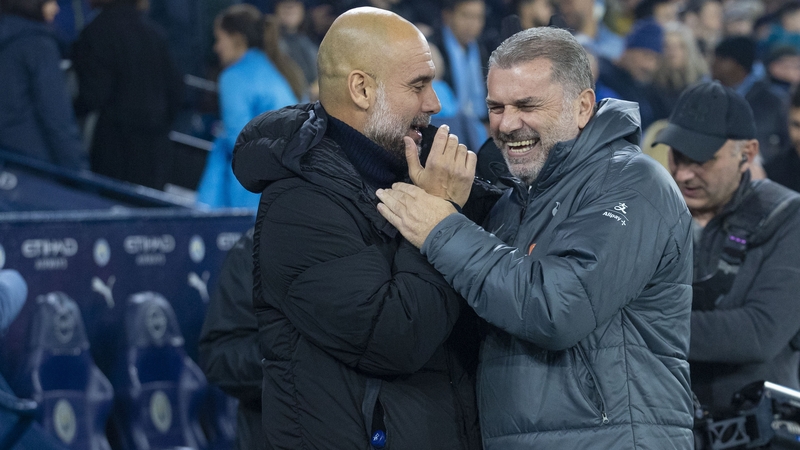 Pep Guardiola (L) and his Manchester City side travel to Ange Postecoglou's Tottenham on Wednesday