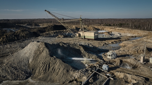 A bucket-wheel excavators extract rare earth minerals from the soil in Ukraine's Zhytomyr region