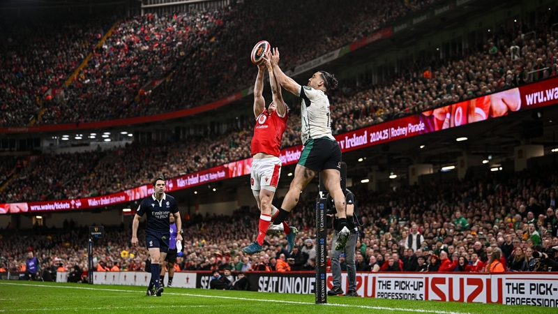 James Lowe taps the ball down for Jamie Osborne to score Ireland's second try against Wales