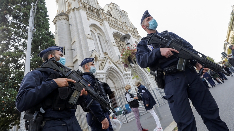 Police on duty outside the church in Nice after the attack