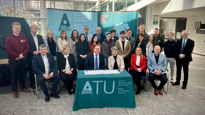 Minister for Further and Higher Education James Lawless and Fine Gael TD Frank Feighan with staff from ATU
