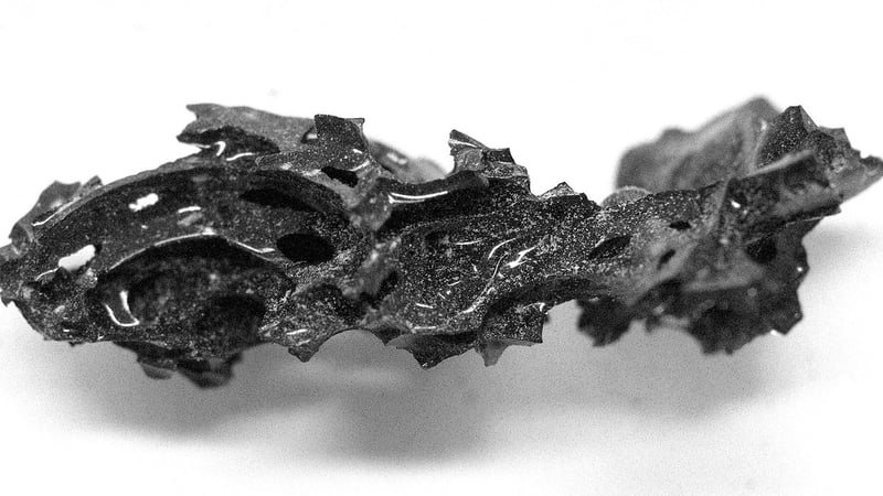 A fragment of the organic glass that was found inside the skull of the deceased individual