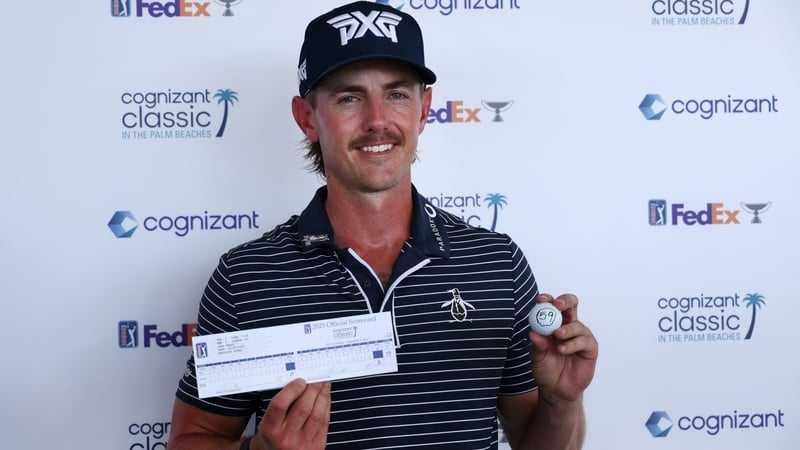 Knapp poses with his scorecard and ball after his round