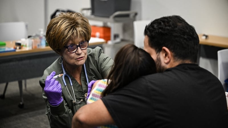 A young child is given the MMR vaccine at the health centre in Lubbock, Texas