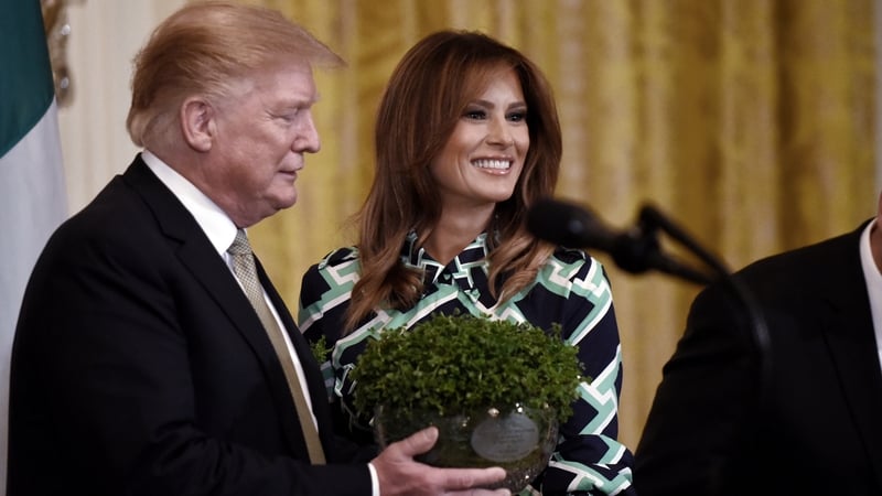 Donald Trump seen receiving the traditional bowl of shamrock in 2019 during his previous White House term