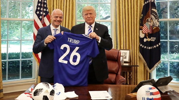 Gianni Infantino poses for photographs with Donald Trump