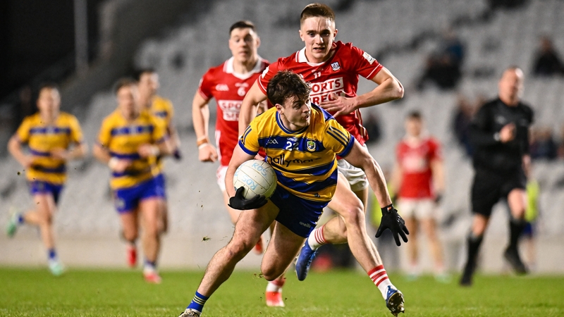 Roscommon's Ben O'Carroll gets away from Cork defender Tommy Walsh