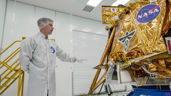 Mission Operations Engineer Jaxon Liebeck showcases the Blue Ghost moon lander at Firefly Aerospace headquarters last December