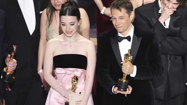 Anora's Oscar-winning star Mikey Madison and writer-director Sean Baker share a moment as the film wins Best Picture