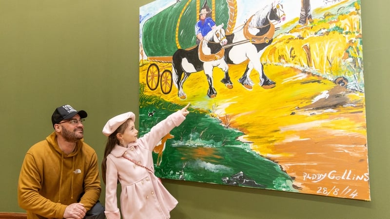 Amy Collins (7), daughter of artist Paddy Collins (L), in front of his painting On the Road Again at the Hugh Lane (Pics: Naoise Culhane)