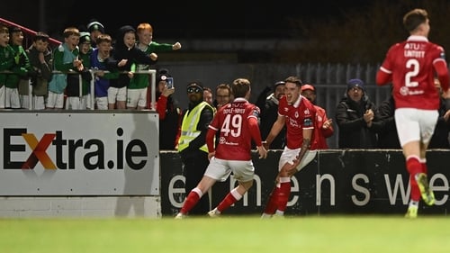 Reece Hutchinson delights some of Sligo Rovers' young fans by giving the home side the lead