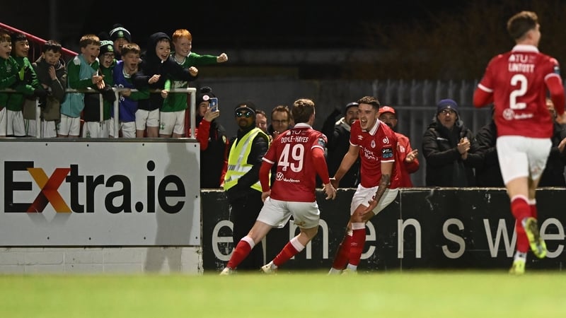 Reece Hutchinson delights some of Sligo Rovers' young fans by giving the home side the lead