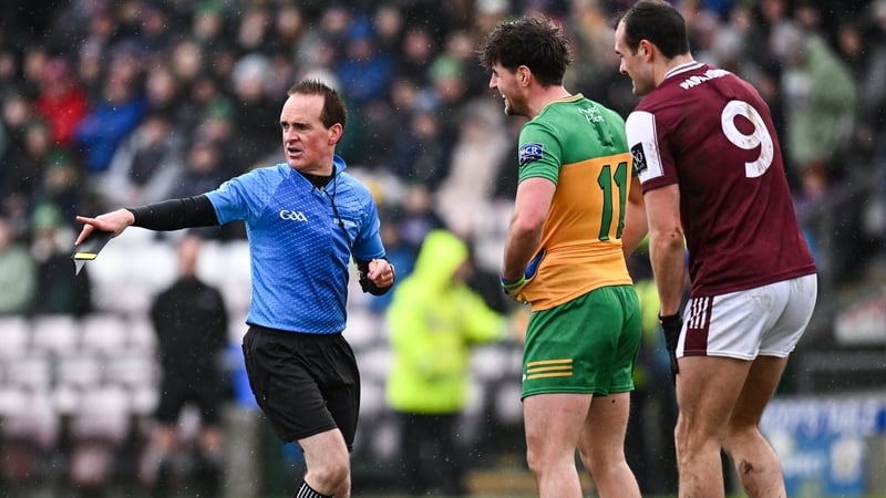 Referee David Coldrick explains his decision to Donegal's Dáire Ó Baoill and John Maher of Galway