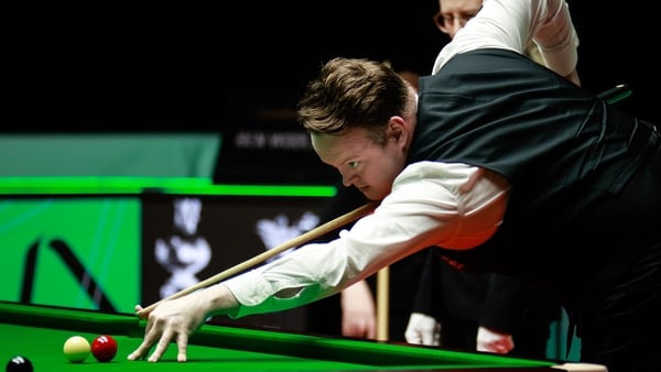 Shaun Murphy plays a shot in the first round match against Ben Woollaston