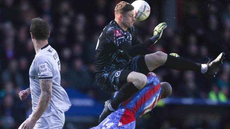 Liam Roberts fouls Crystal Palace's Jean-Philippe Mateta