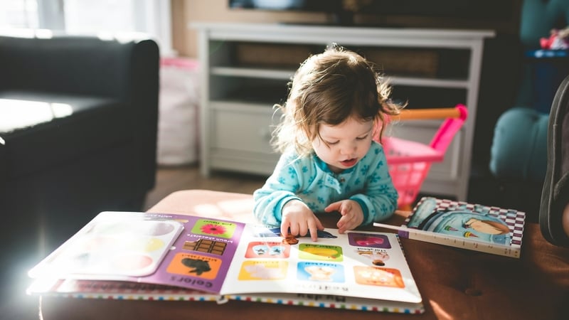 'Books with thick pages are good for small hands to manage'. Photo: Stephen Andrews/Unsplash