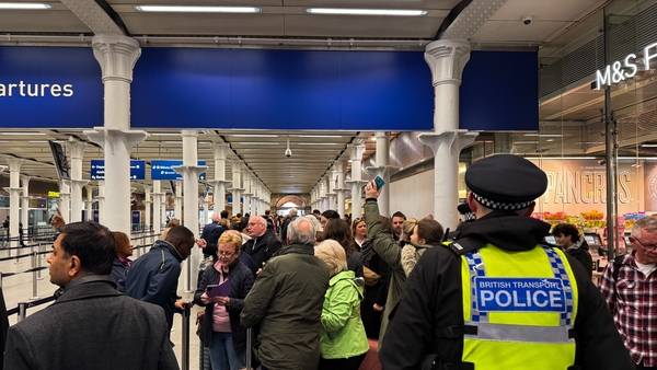 People gather at St Pancras Station in London after their Eurostar trains to Paris were cancelled for the day