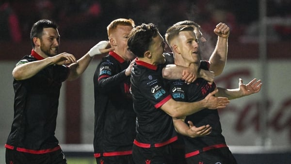 Drogheda United players mob Warren Davis after his goal against Shels