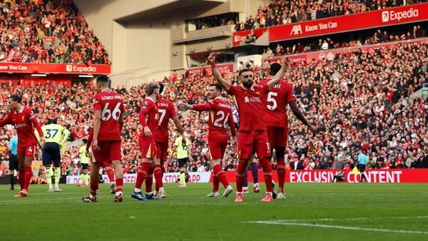Mohamed Salah celebrates scoring Liverpool's third goal at Anfield